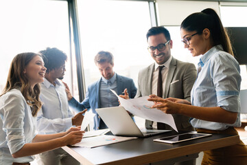 Portrait of successful business team working in office