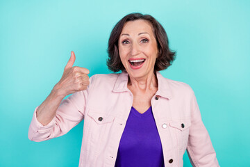 Poster - Photo portrait woman in casual clothes overjoyed showing thumb-up sign isolated bright teal color background