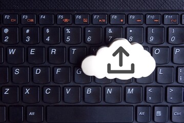 Wall Mural - technology, cloud computing concept. white cloud with upload icon on keyboard
