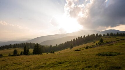 Wall Mural - Time lapse at sunset with beautiful moving clouds over the tree-covered mountain slopes, the Rhodopes in Bulgaria