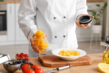 Sticker - Male chef with tagliatelle pasta in kitchen, closeup