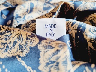 written made in italy on blue silk foulard
