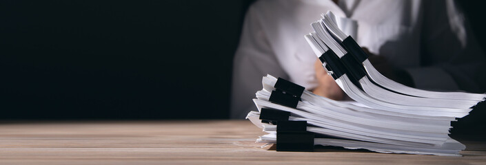 Wall Mural - woman holding stack of documents