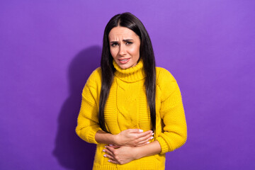 Sticker - Photo of unsatisfied attractive person arms on stomach feeling bad isolated on violet color background