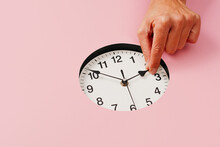 Man Sets Clock Backward Or Forward