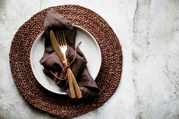 Wall Mural - Top view of decorated table setting dish with fallen leaf. Dinner concept.