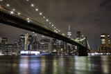 Fototapeta  - Brooklyn bridge as seen from the brooklyn waterfront at night