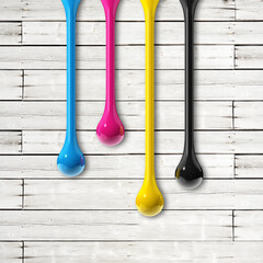 Wall Mural - cmyk ink drops on white wooden square background