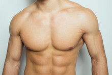 The Torso Of A Young Athletic Guy. Concept: The Male Body After Exercise And Diet. Men's Health: Shaved Breasts