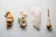 © Cavan Images - Four stages: raw wool, washed wool, combed wool and yarn