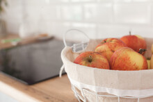 Apples In A Basket On White Scandinavian Kitchen