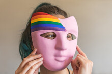 Woman Preparing For Pride Day With Handmade Mask With LGBTI Flag
