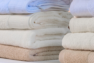 Leinwandbilder - Colorful folded towels stack closeup picture.