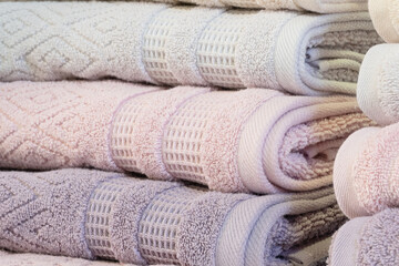 Leinwandbilder - Colorful folded towels stack closeup picture.
