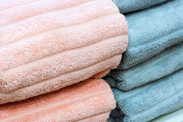 Poster - Colorful folded towels stack closeup picture.
