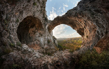 An Ancient Cave And A Rock Arch Form The Image Of A Stone Heart