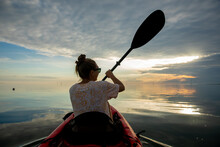 Female Kayaking At Smith Island In Maryland.