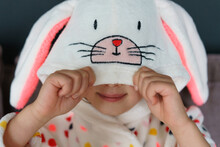 Young Girl Wearing Easter Bunny Robe.