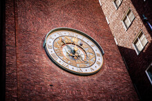 Low Angle View Of Clock On Building Wall