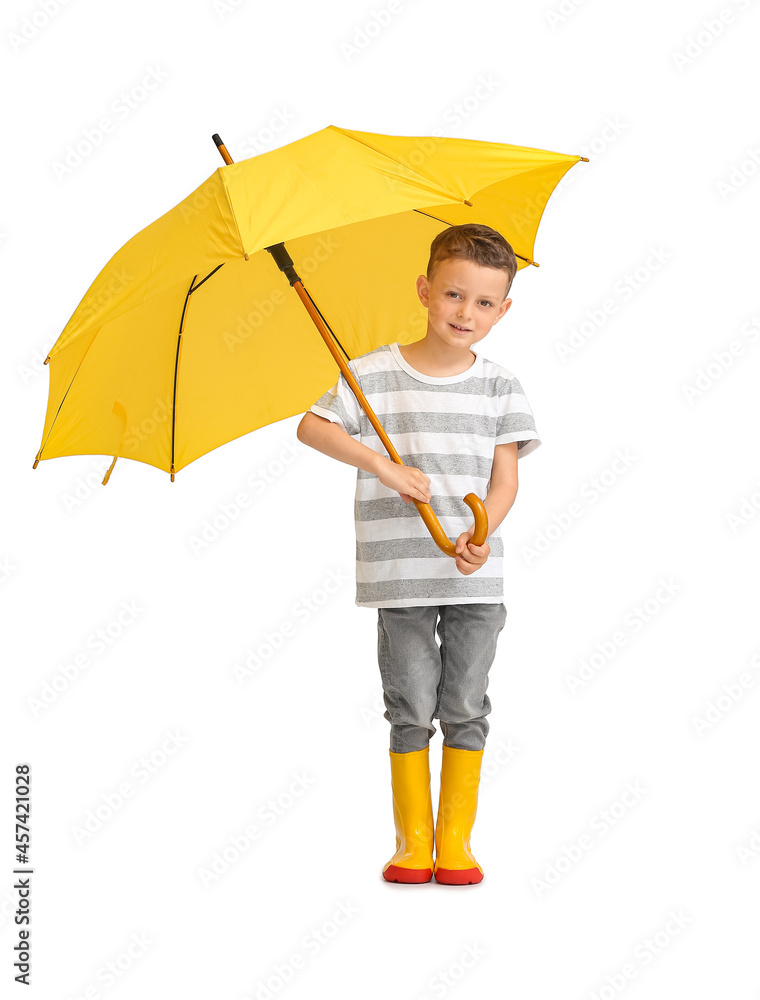 Cute little boy with umbrella on light background
