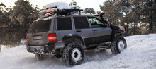 One SUV 4x4 Cars Go On Snowy Road, Winter Season