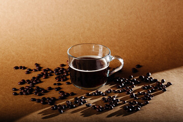 Canvas Print - Closeup shot of a glass of coffee with coffee beans