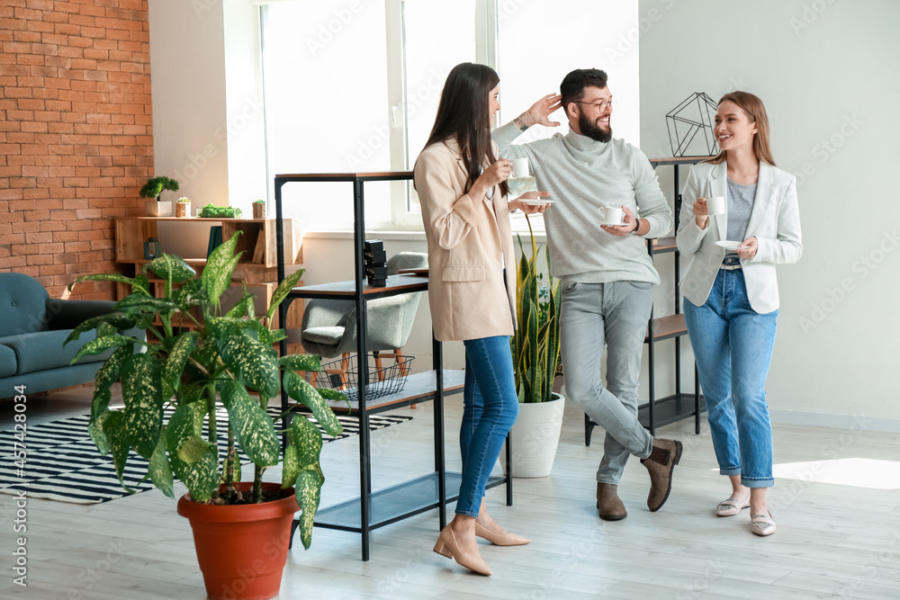 People having coffee break in office
