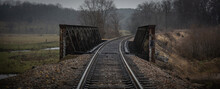 Railroad Tracks In Foggy Weather