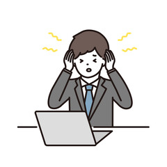 ノートパソコンの前で頭痛・耳鳴りに悩むビジネスマン