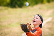 © Kostia - A Happy child with baseball ball on nature concept in park