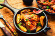 Baked chicken leg with potatoes and figs