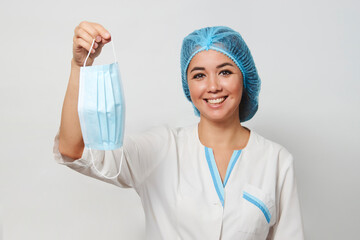 Wall Mural - Doctor wearing medical mask, close-up portrait