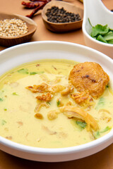 Wall Mural - Nasi Soto Ayam or Soto Medan is  Traditional chicken soup with rice from Medan, North Sumatra. 

Soto is a traditional Indonesian soup mainly composed of broth, meat, fried patties and vegetables.