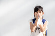 Asian child girl sick with sneezing on the nose and cold cough on tissue paper because weak or virus and bacteria from dust weather