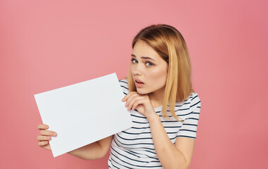 Wall Mural - blonde woman in a striped T-shirt with a white sheet in hand banner Copy space