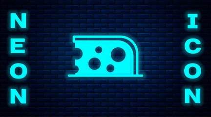 Sticker - Glowing neon Cheese icon isolated on brick wall background. Vector