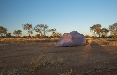 Sticker - Shot of a purple tent on the sand in the outback of Australia during sunset