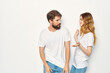 © SHOTPRIME STUDIO - cheerful young couple in white t-shirts embrace friendship lifestyle