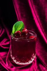 Canvas Print - cherry cocktail on red velvet