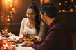 © Syda Productions - holidays, eating and celebration concept - happy couple having christmas dinner at home