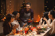 © Syda Productions - holidays and celebration concept - multiethnic group of happy friends having christmas dinner at home