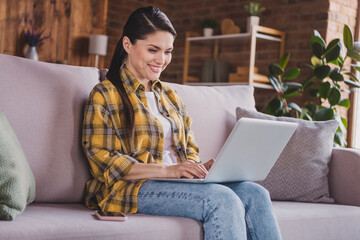 Poster - Photo of charming cheerful people sitting on couch beaming smile write typing social network user house indoors