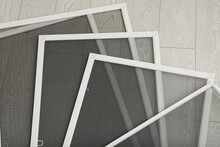 Set Of Window Screens On Wooden Floor, Flat Lay