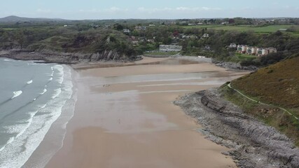 Wall Mural - The huge surfing beach of Caswell Bay, on the South Wales Coast Path, at low tide