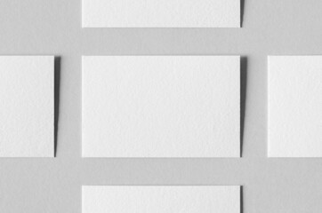 Wall Mural - Textured business card mockup on a grey background. 85x55 mm.