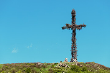 Wall Mural - A large Christian cross consisting of many similar small crosses in the memorial park in Armenia. The number of crucifixes increases every year