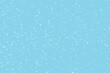 Winter snowfall and snowflakes on light blue background. Hand drawn snow pattern. Doodle cold winter sky background. Vector illustration