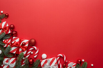 Wall Mural - red christmas background with fir ornaments and holiday gifts