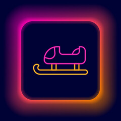 Sticker - Glowing neon line Sled icon isolated on black background. Winter mode of transport. Colorful outline concept. Vector