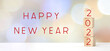 © mangpor2004 - Wooden cubes with 2022 and happy new year over blur bokeh background, banner new year greeting card